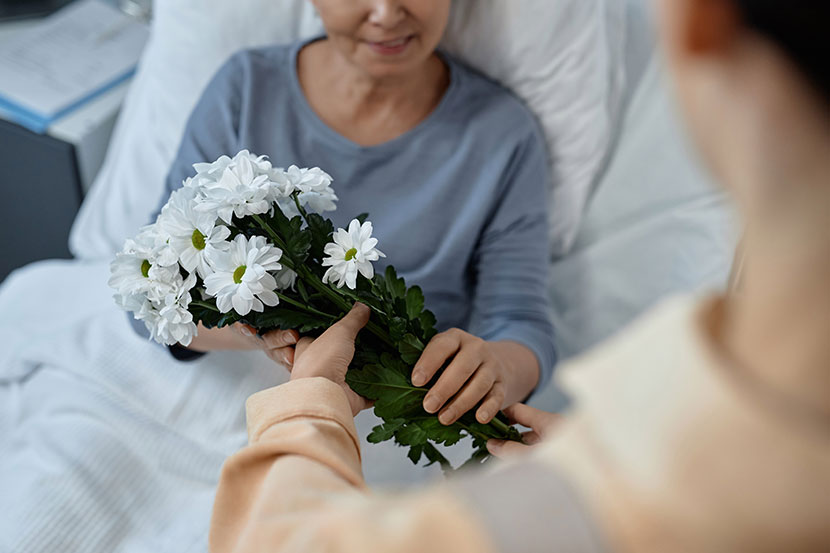 Visitor bring patient flowers