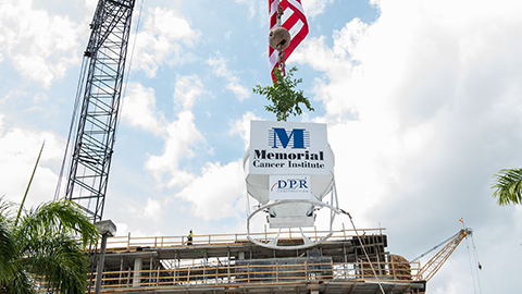 topping off structure being raised at new MCI building at construction site