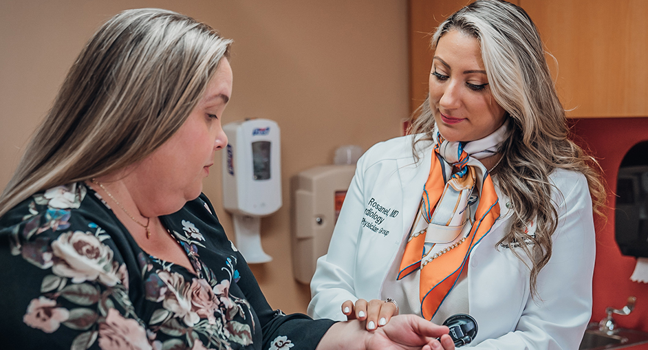 Dr. Rosanel with patient