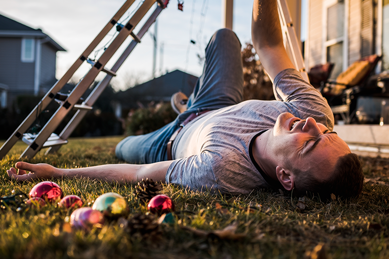 man fallen off ladder hanging decorations outside home