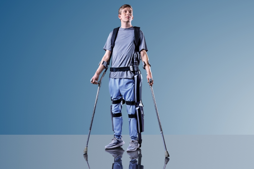Neurology patient standing using exoskeleton