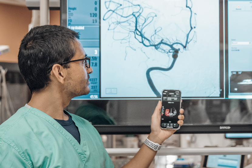 Doctor and assistant reviewing stroke image