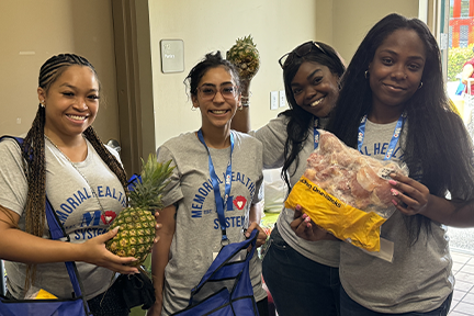 attendees holding groceries at OCAT Miramar