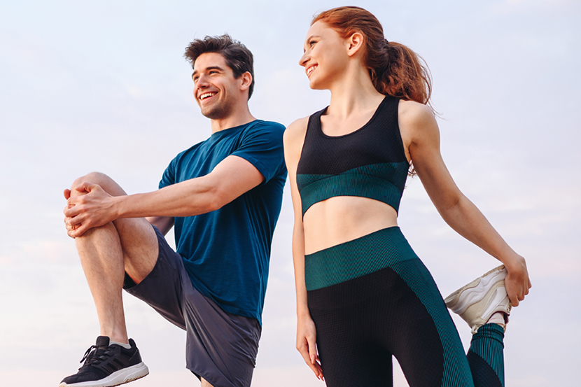 Couple stretching legs and knees