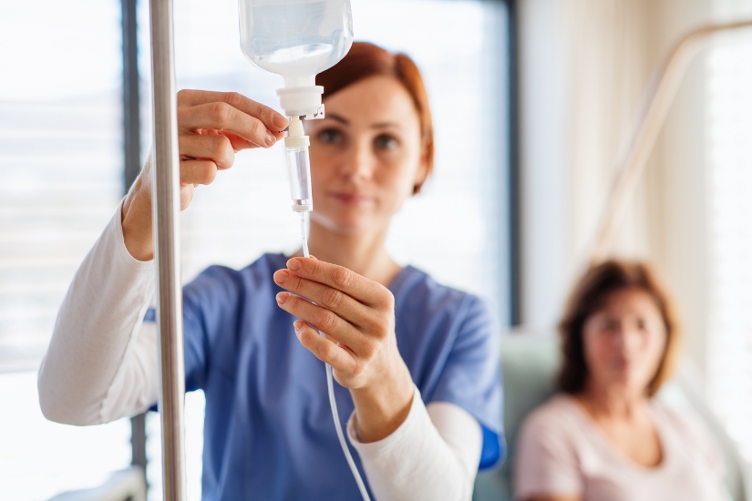 Infusion Services specialist with patient setting up an infusion medication